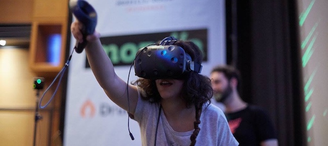 Person playing with virtual reality headset 